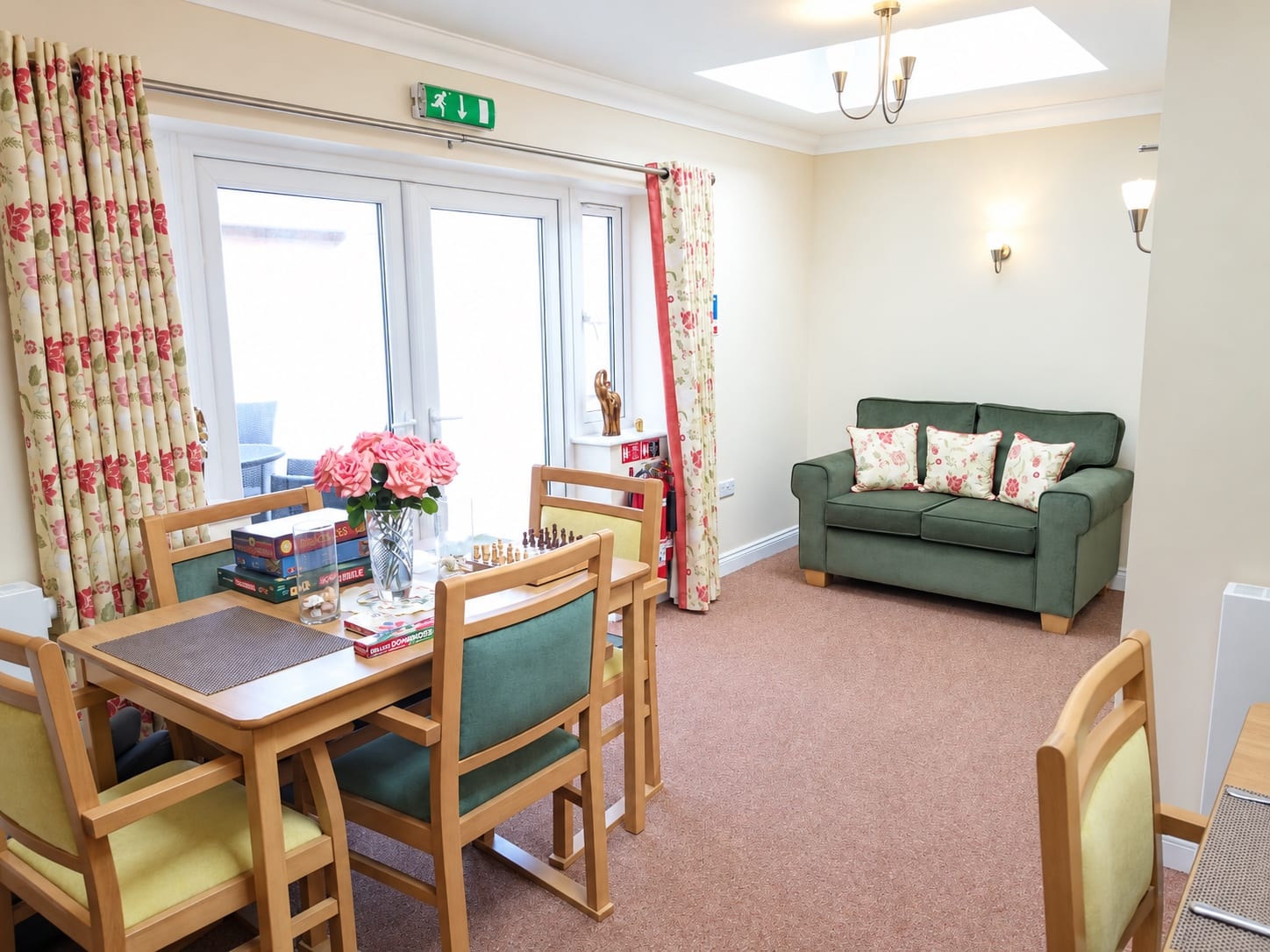 The lounge diner, with a games table and doors to the garden.